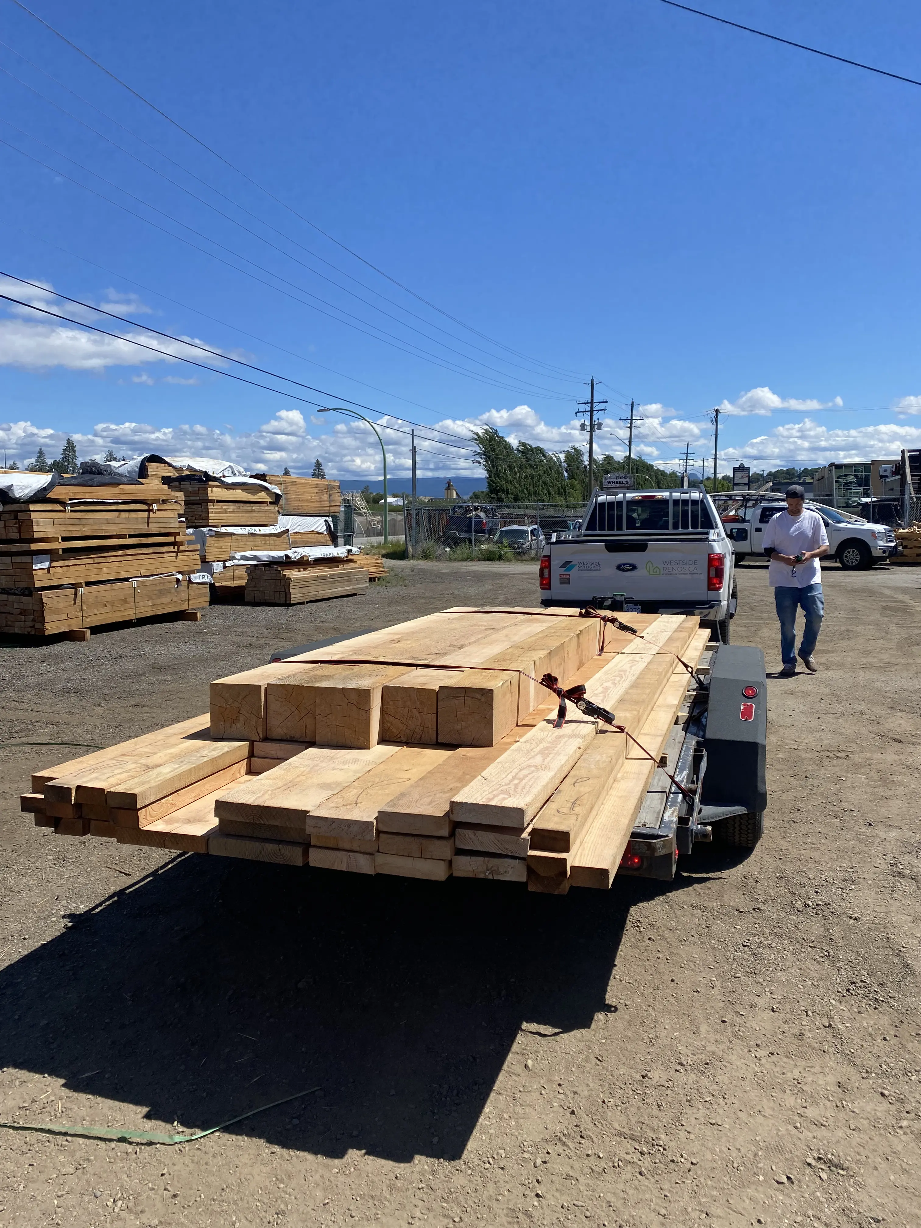 Fresh lumber loaded on trailer in the yard