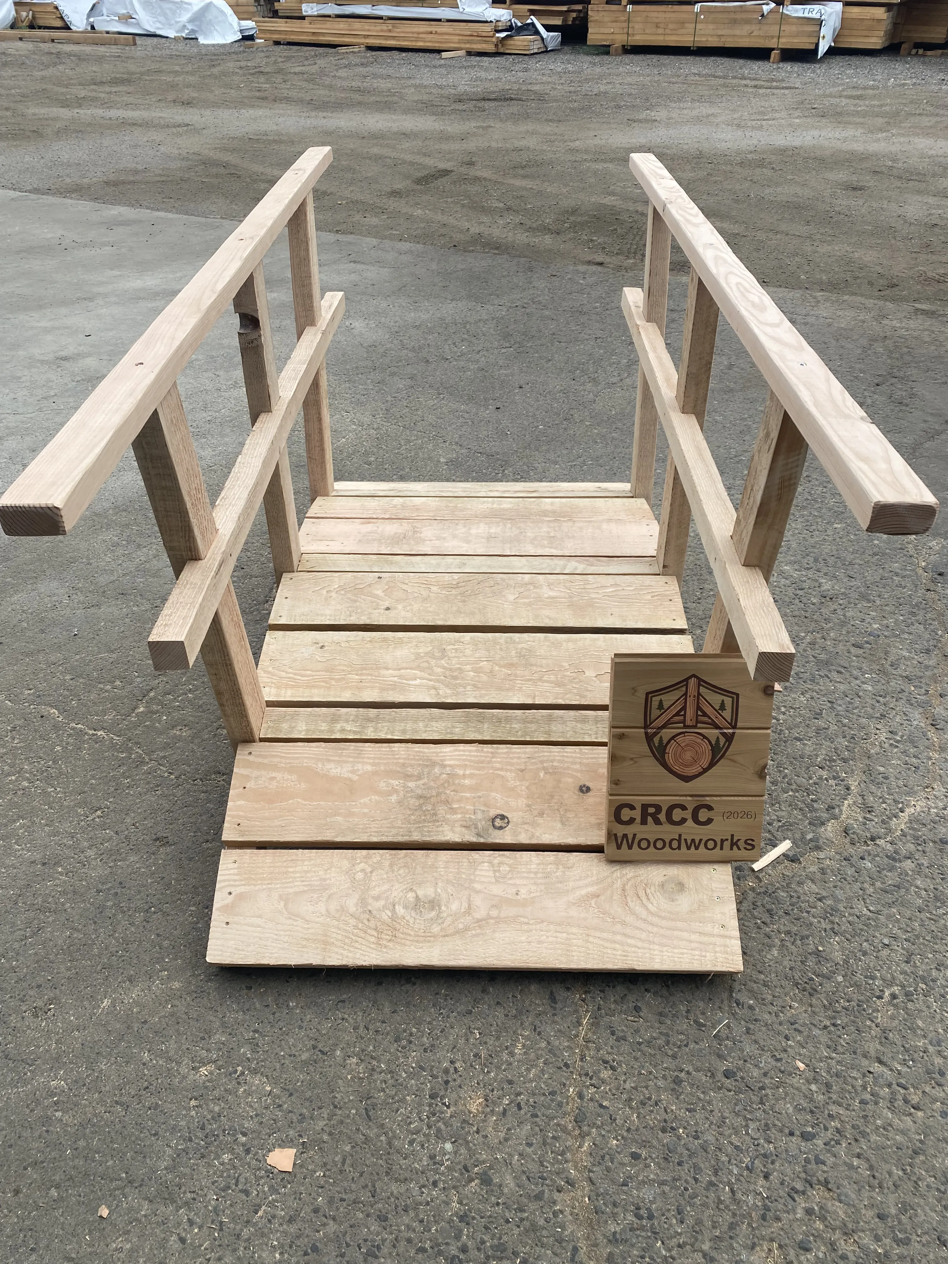 Small garden bridge with CRCC Woodworks sign