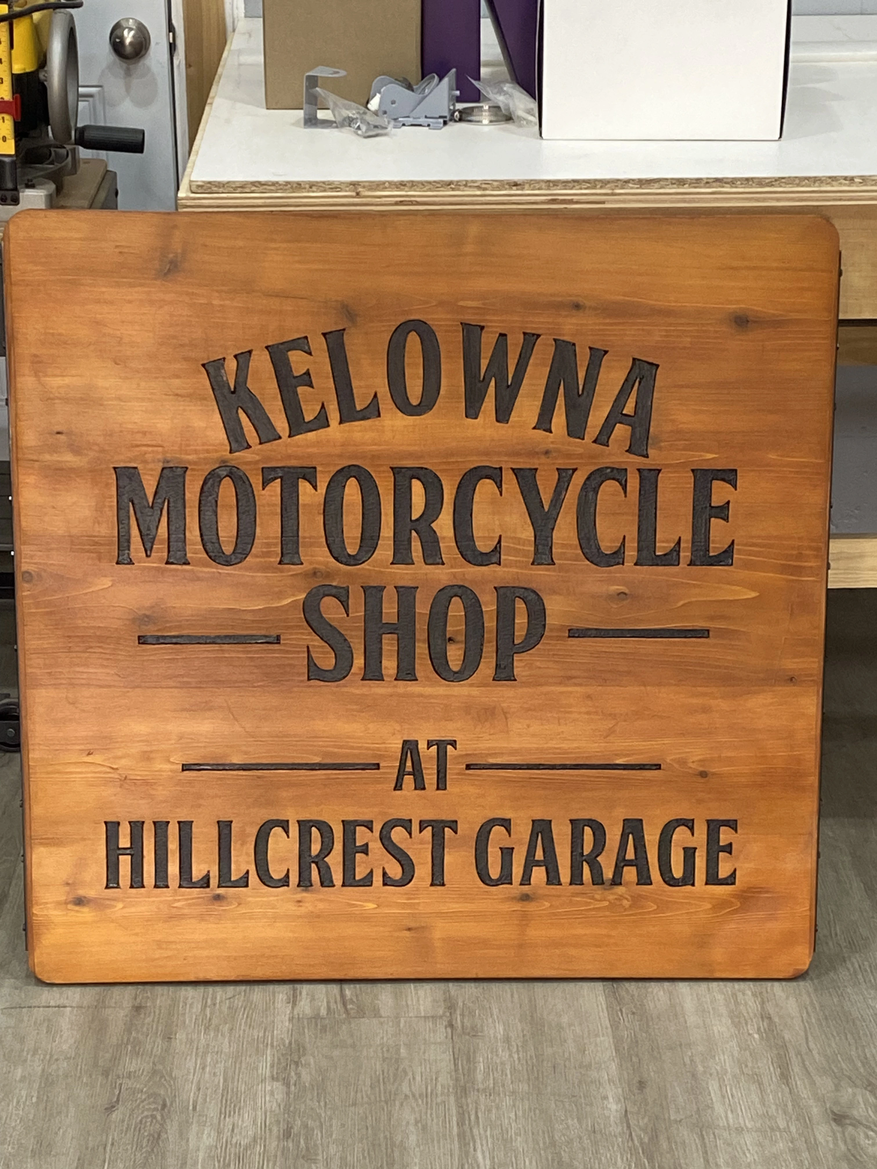 Finished stained Kelowna Motorcycle Shop custom sign